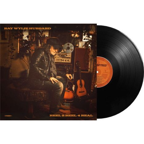 „RAY WYLIE HUBBARD“ und „REEL 2 REEL 4 REAL“ oben und unten. Cover zeigt Musiker mit Gitarren und Tonstudio.