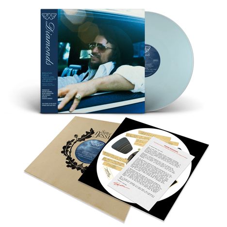 Texte: "Diamonds", "Brand New Waylon Jennings Album". 
Vinyl in blauem Cover mit Foto eines Mannes am Steuer. Beilagen dabei.