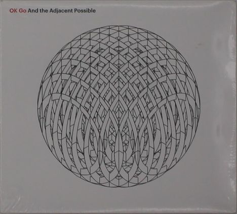 "OK Go And the Adjacent Possible". Ein komplexes, geometrisches Muster in Kugelform auf weißem Hintergrund.