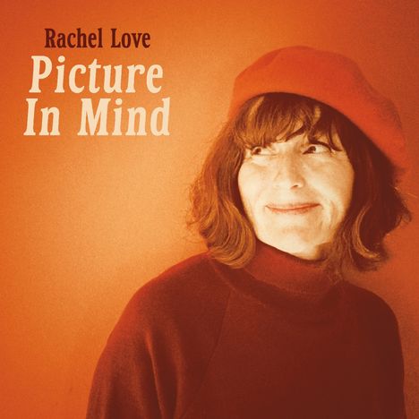 Text: "Rachel Love - Picture In Mind." Eine Frau mit rotem Barett lächelt und schaut zur Seite, vor einem orangefarbenen Hintergrund. 
