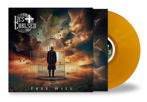 "Les Carlsen" und "Free Will" stehen über und unter einem Mann in einem Käfig, umgeben von Vögeln. Goldenes Vinyl sichtbar.