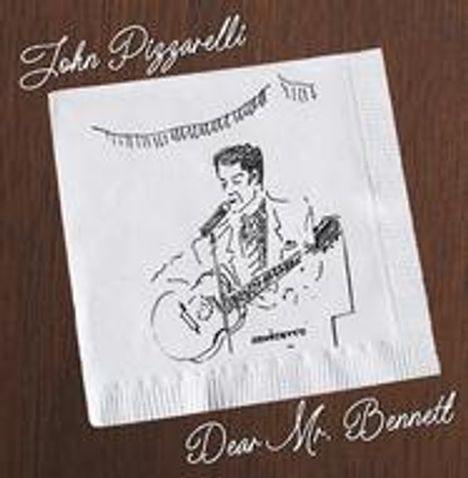Text: "John Pizzarelli, Dear Mr. Bennett". Zeichnung eines Mannes mit Gitarre auf einer Serviette, Holzuntergrund.
