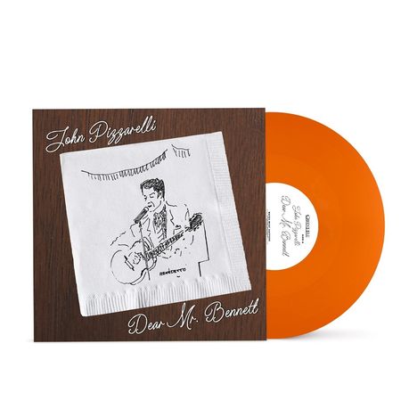 "John Pizzarelli" und "Dear Mr. Bennett" in Handschrift auf braunem Hintergrund, Skizze eines Gitarristen auf einer Serviette.