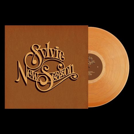 Text: "Sylvie New Season". Plattencover in Braun mit stilisierter Schrift und orangefarbene Vinyl-Schallplatte.
