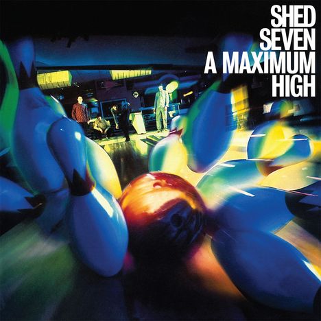 Text: "SHED SEVEN A MAXIMUM HIGH." 
Bowlingkegel und -kugel fliegen dynamisch durch die Luft. Beleuchtung ist bunt und lebendig.