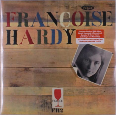Text: "FRANÇOISE HARDY", "2-LP LIMITED PRESSING ON OPAQUE ORANGE VINYL." Holzoptik mit Schwarzweißfoto einer Frau.