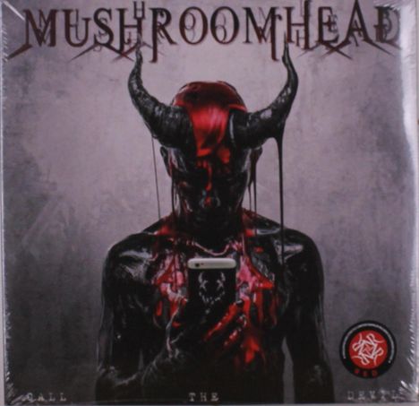 „Mushroomhead“, „Call the Devil“. Ein dämonischer Charakter mit Hörnern, hält ein Telefon, rot-schwarz bemalt. Logo unten rechts.