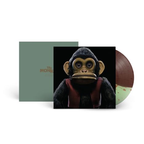 "The Monkey" steht auf einem grünlichen Cover. Ein Affe mit Weste ist zentral, daneben eine bunte Vinyl-Schallplatte.