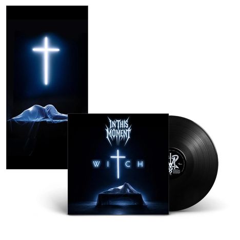 "In This Moment", "WITCH" in weißer Schrift, leuchtendes Kreuz, bedeckte liegende Gestalt, Vinyl-Schallplatte sichtbar.
