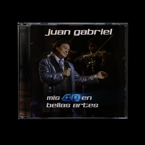 "juan gabriel", "mis 40 en bellas artes"; ein Sänger in Glitzerjacke, hält ein Mikrofon, Musiker mit Geigen im Hintergrund.