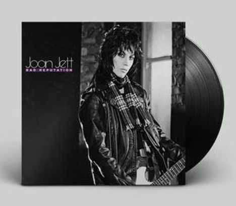 Text: "Joan Jett, Bad Reputation". Schwarz-weißes Cover mit Person in Lederjacke und Schal, Vinyl-Schallplatte sichtbar.