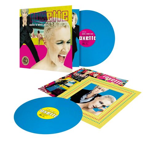 Text: "roxette", "HAVE A NICE DAY". Zwei blaue Vinyl-Schallplatten, bunte Covergestaltung mit Porträts.