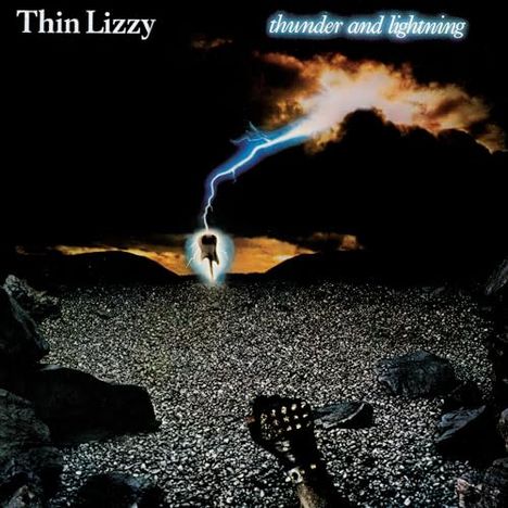 Text: "Thin Lizzy", "thunder and lightning". Eine Illustration zeigt eine Blitzhand über steiniger Landschaft.