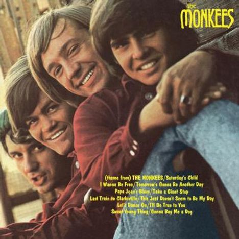 "The Monkees" in gelber Schrift. Liedtitel darunter: "theme from THE MONKEES", "Saturday's Child", "I Wanna Be Free" usw. Vier junge Männer lächeln.