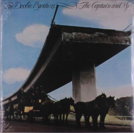 "The Doobie Brothers The Captain and Me." Eine Kutsche mit Pferden unter einem unvollendeten Brückenbauwerk vor blauem Himmel.