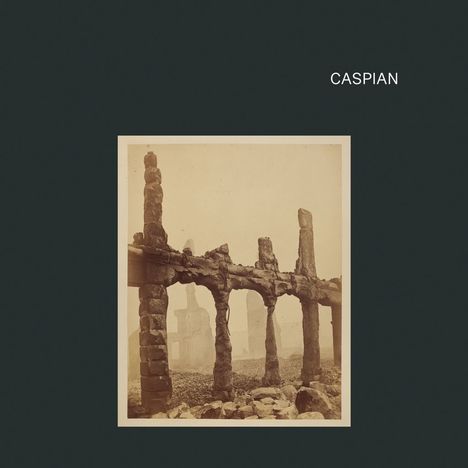 Der Text "CASPIAN" steht oben rechts. Darunter eine historische Fotografie von ruinösen Steinbögen auf einem dunklen Hintergrund.
