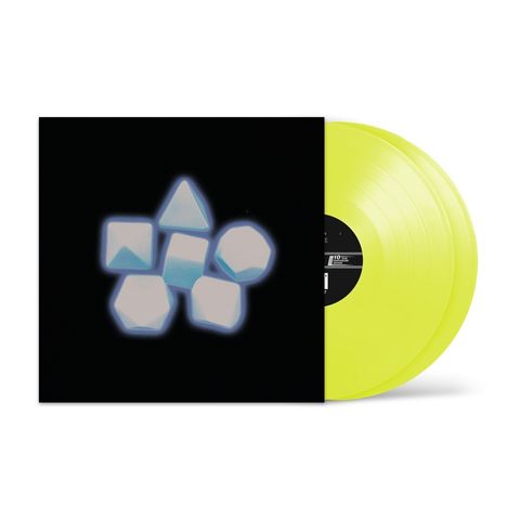 Gelbes Vinyl, schwarzes Cover mit leuchtenden geometrischen Formen: Würfel, Pyramiden und andere.