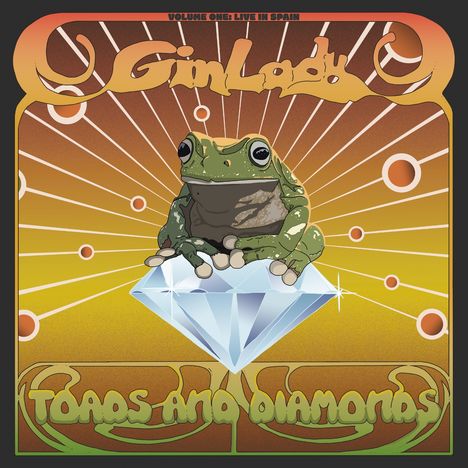 „Volume One: Live in Spain“, „Gin Lady“, „Toads and Diamonds“. Eine Kröte sitzt auf einem großen Diamanten vor strahlenförmigem Hintergrund.