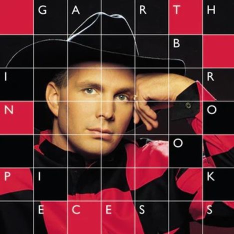"GARTH BROOKS IN PIECES" steht in weißen Buchstaben. Ein Mann mit Cowboyhut lehnt seinen Kopf auf die Hand.