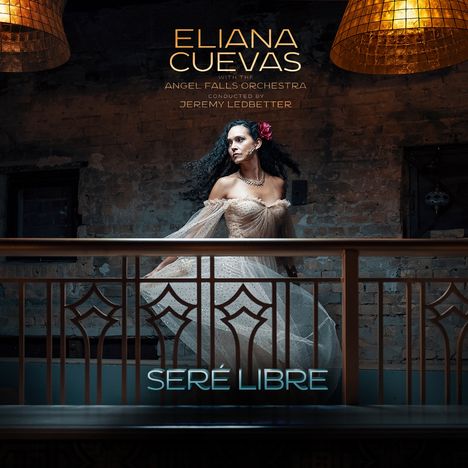 "ELIANA CUEVAS with the ANGEL FALLS ORCHESTRA conducted by JEREMY LEDBETTER, SERÉ LIBRE". Frau in elegantem Kleid.