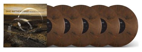 Albumcover und braune Vinylplatten. Text: "Dave Matthews Band Take Me Back Live from the Gorge". Rustikaler Landschaftshintergrund.