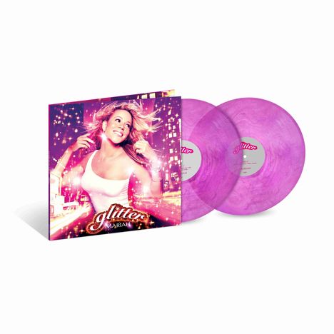 Der Text lautet "glitter" und "Mariah". Zwei lila Schallplatten und ein Albumcover mit einer lächelnden Frau.