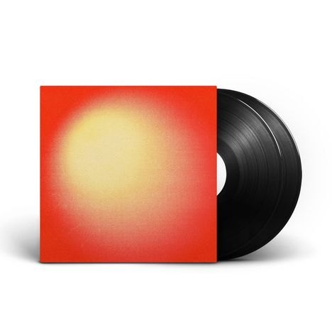 Das Bild zeigt ein Schallplattenalbum, dessen Hülle in Rot mit einem erleuchteten gelben Zentrum gestaltet ist.