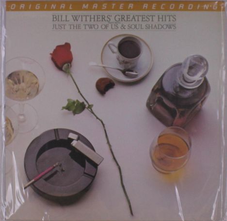 Text: "Bill Withers' Greatest Hits. Just the Two of Us & Soul Shadows". 
Elemente: Rose, Tasse Kaffee, Karaffe, Aschenbecher.