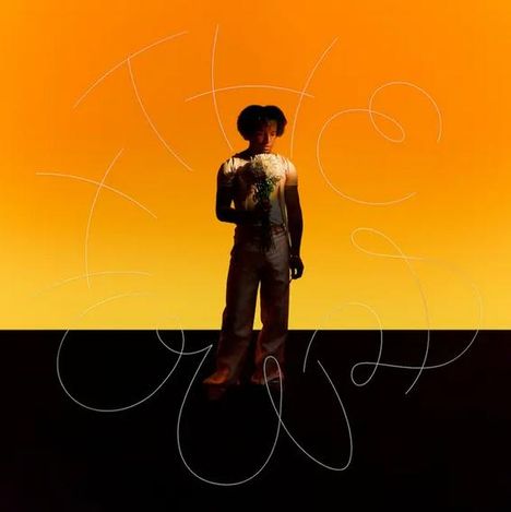 Weiße schwungvolle Schrift: "The Good Within". Eine Person hält Blumen, vor einem hellen gelb-orangenen Hintergrund.