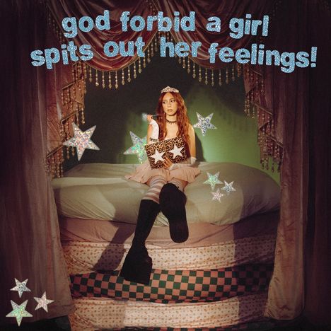 „God forbid a girl spits out her feelings!“ Ein Mädchen sitzt auf einem Bett mit Sternendekoration unter einem Baldachin.