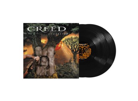 „Creed Weathered“ Albumcover mit Bäumen, Gesichtern in der Rinde und Sonnenuntergang. Vinyl-Schallplatte daneben.