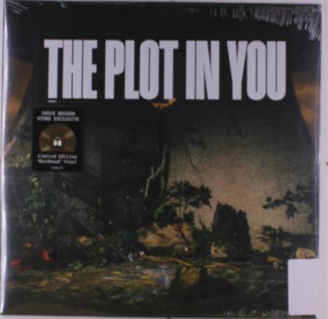 „THE PLOT IN YOU“ Schriftzug oben, dekorative Pflanzen und Steine im Hintergrund, Vinyl-Aufkleber links.