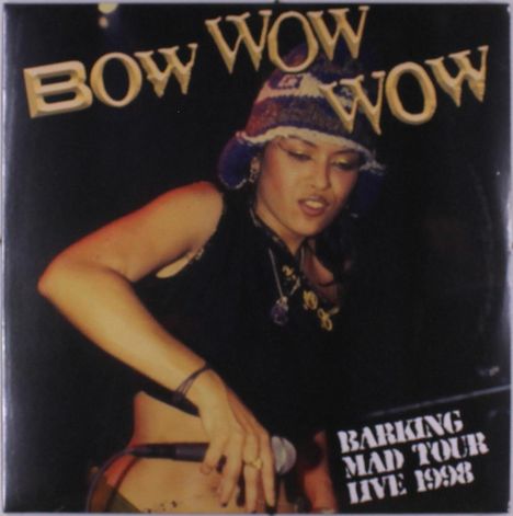 Text oben: "BOW WOW WOW". Unten: "Barking Mad Tour Live 1998". Frau mit Mikrofon und bunter Mütze.