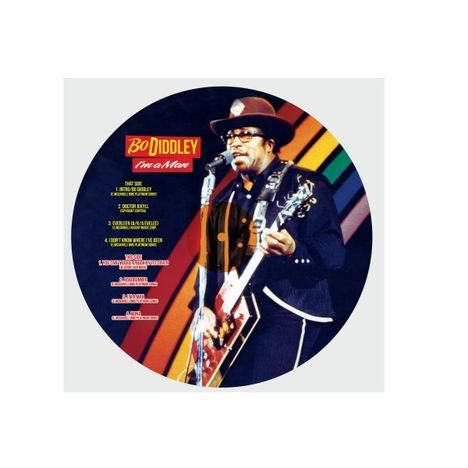 "Bo Diddley I'm a Man" und eine Songliste. Bo Diddley spielt Gitarre vor einem regenbogenfarbenen Hintergrund.
