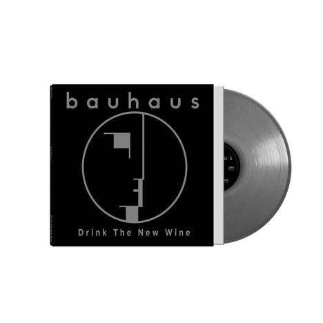 "bauhaus", "Drink The New Wine". Ein schwarzes Albumcover mit einem stilisierten Gesicht in einem Kreis, daneben eine graue Schallplatte.