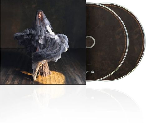 Zwei CDs mit einem Coverbild einer Frau in fließendem, grauem Kleid auf Holzboden in sanftem Licht.