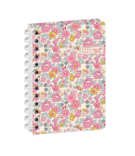 2026-2027, Quo Vadis. Notizbuch mit spiralgebundenem, floralen Design in Rosa, Gelb und Blau auf hellem Hintergrund.