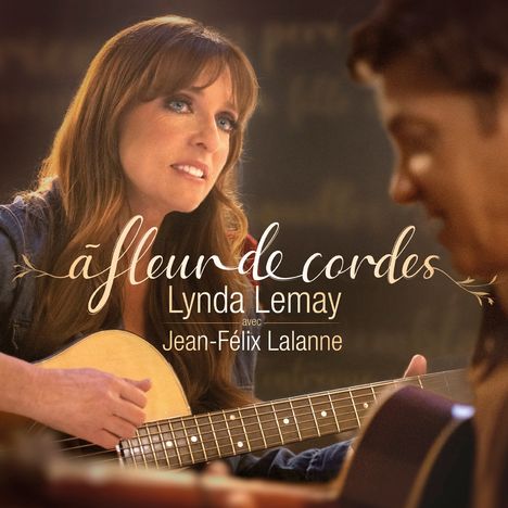 „à fleur de cordes“ Lynda Lemay avec Jean-Félix Lalanne. Eine Frau spielt Gitarre und schaut zu einem Mann.