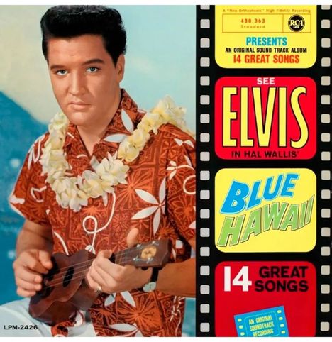 Text: "See Elvis in Hal Wallis’ Blue Hawaii. 14 Great Songs."  
Ein Mann in Hawaiihemd und Blumenkette spielt Ukulele.