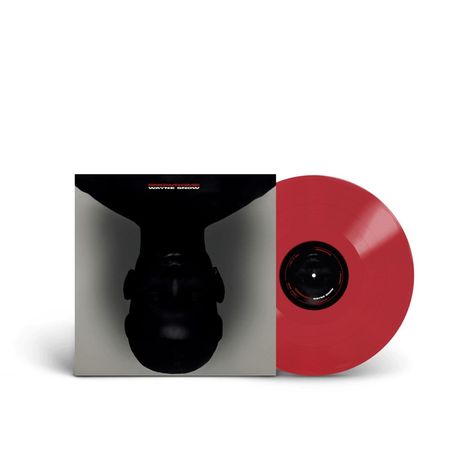 Text: "WAYNE SNOW." Ein rotes Vinyl mit einem Cover zeigt ein nach unten gerichtetes, dunkles Gesicht.