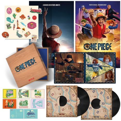 Verschiedene "One Piece"-Elemente: Poster, Sticker, Figuren und Schallplatten mit Piraten- und Abenteuerdesigns.