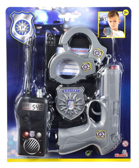 Text: "POLIZEI", "CODE 548", "SWISS ID CARD". Spielzeugset mit Handschellen, Pistole und Funkgerät. Ein Junge hält ein Abzeichen.
