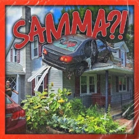 Text: "SAMMA?!" Großes Auto in einem Hausdach. Roter Rahmen. Zeichnung voller Chaos.