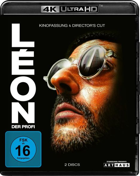 „LÉON DER PROFI“, „KINOFASSUNG & DIRECTOR'S CUT“, „FSK ab 16 freigegeben“, „2 DISCS“. Nahaufnahme eines bärtigen Mannes mit Brille.