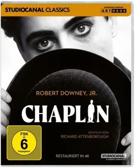 "Chaplin" mit Robert Downey Jr., FSK 6, restauriert in 4K, Film von Richard Attenborough. Ein Gesicht und eine Silhouette.