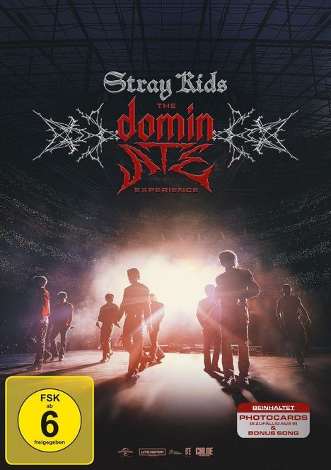 Stray Kids: The Dominator Experience. FSK ab 6 freigegeben. Enthält Photocards & Bonussong. Silhouetten vor heller Bühne.