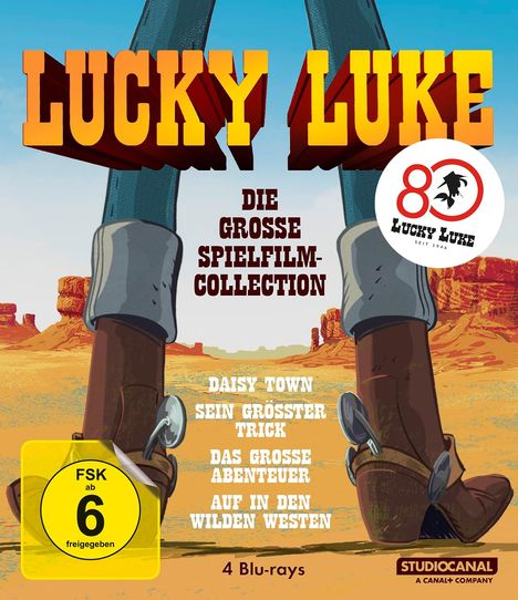 "Lucky Luke: Die große Spielfilm-Collection. Daisy Town, Sein größter Trick, Das große Abenteuer, Auf in den Wilden Westen." Cowboy-Stiefel und Wüstenlandschaft.