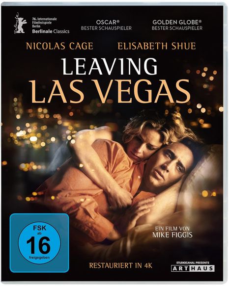 "Leaving Las Vegas" zeigt eine Frau und einen Mann in einer innigen Umarmung, umgeben von unscharfen Lichtern.