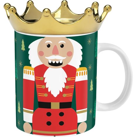 Becher mit Nussknacker-Illustration in Rot und Gold auf grünem Hintergrund, goldene Krone als Deckel.