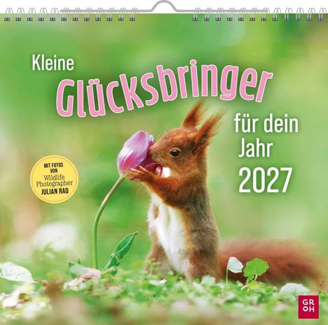 "Kleine Glücksbringer für dein Jahr 2027." Ein Eichhörnchen hält eine rosa Blume in einer grünen Umgebung.